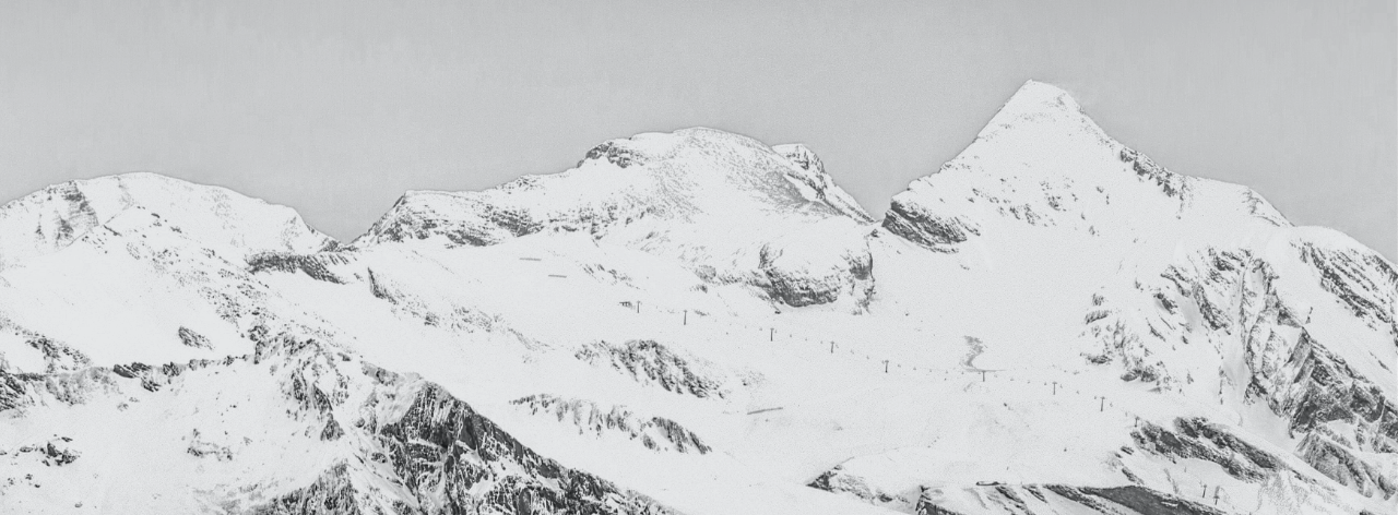 Greyscale snowy mountain peaks